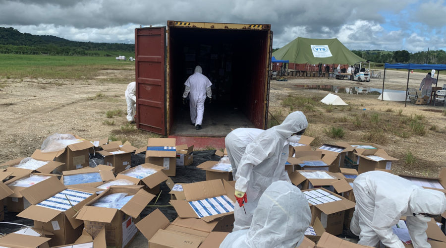 Port Vila International Airport during the Tropical Cyclone Harold response: government staff process received humanitarian supplies for fumigation.