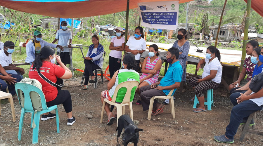 PDRRN Interim Response Manager Ann Ria S. Barrera consults with the officers of the Relocation Area Community Association (RACA) in Virac, Catanduanes for Super Typhoon Goni (locally known as Typhoon Rolly) in November 2020.