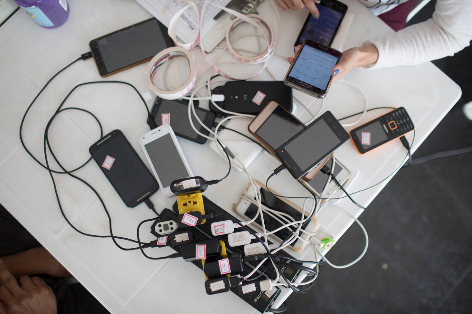 Phones charging in a centre for Venezuelan migrants.