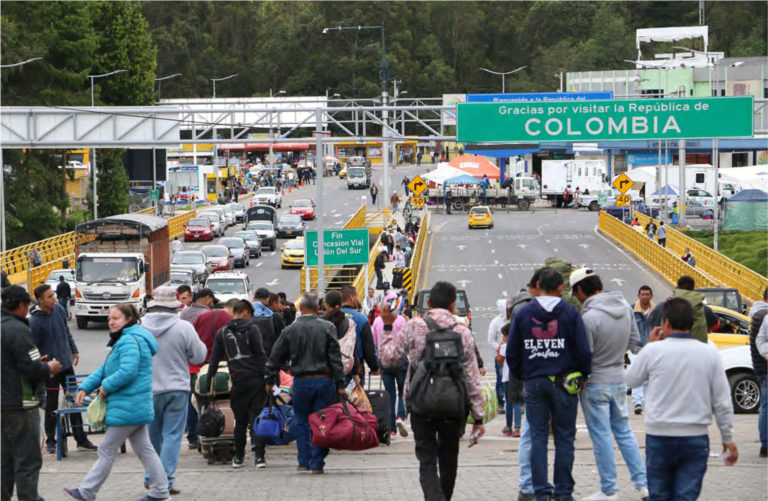 Venezuelan migrants cross the border between Colombia and Ecuador through Rumichaca Bridge, 2018.