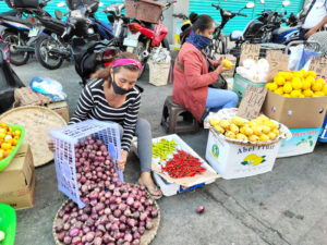 Fruit sellers in the market, Manila